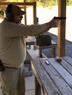 Fat Guy Shooting SR1911 10MM.jpg