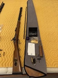 40 rifle, spare ramrodn gunsock and accessories.jpg